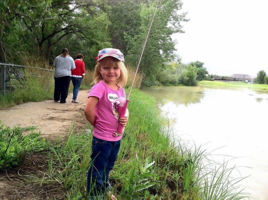Kayda-poses-for-a-picture-at-the-Green-River-fishing-event-on-9-14-13.jpg