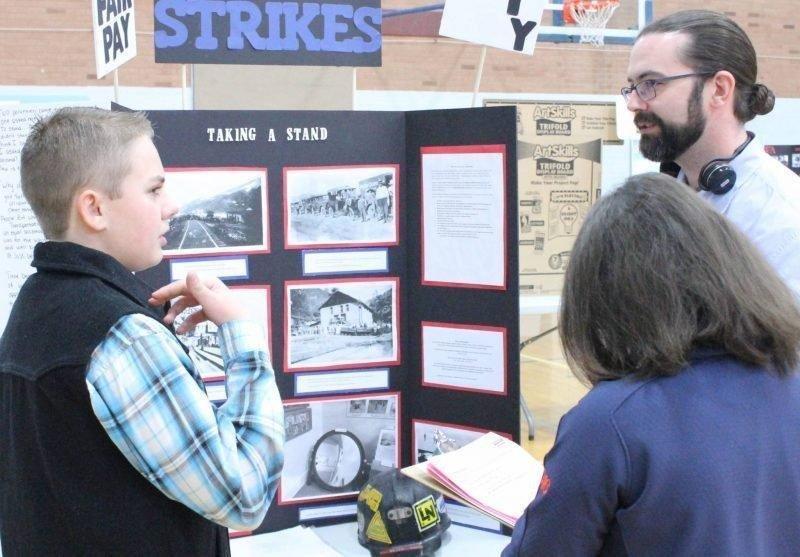 Student-talks-about-his-history-display-with-judges-at-last-years-history-fair.jpg