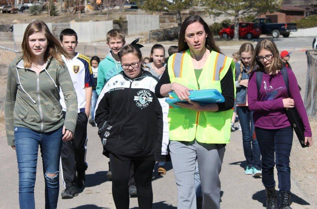 Students-walk-with-Britni-King-toward-the-assembly-area-after-being-evacuated-during-a-drill-at-Mont-Harmon-Middle-School-last-year..jpg