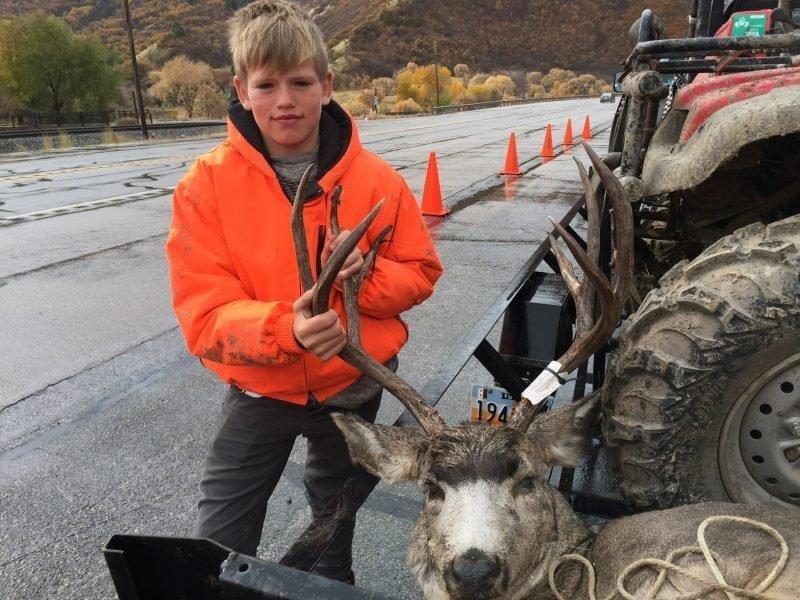 scott_root_10-20-2018_Devin_Allen_at_the_Spanish_Fork_check_station_in_north-central_Utah_shows_the_first_buck_hes_ever_taken.jpg