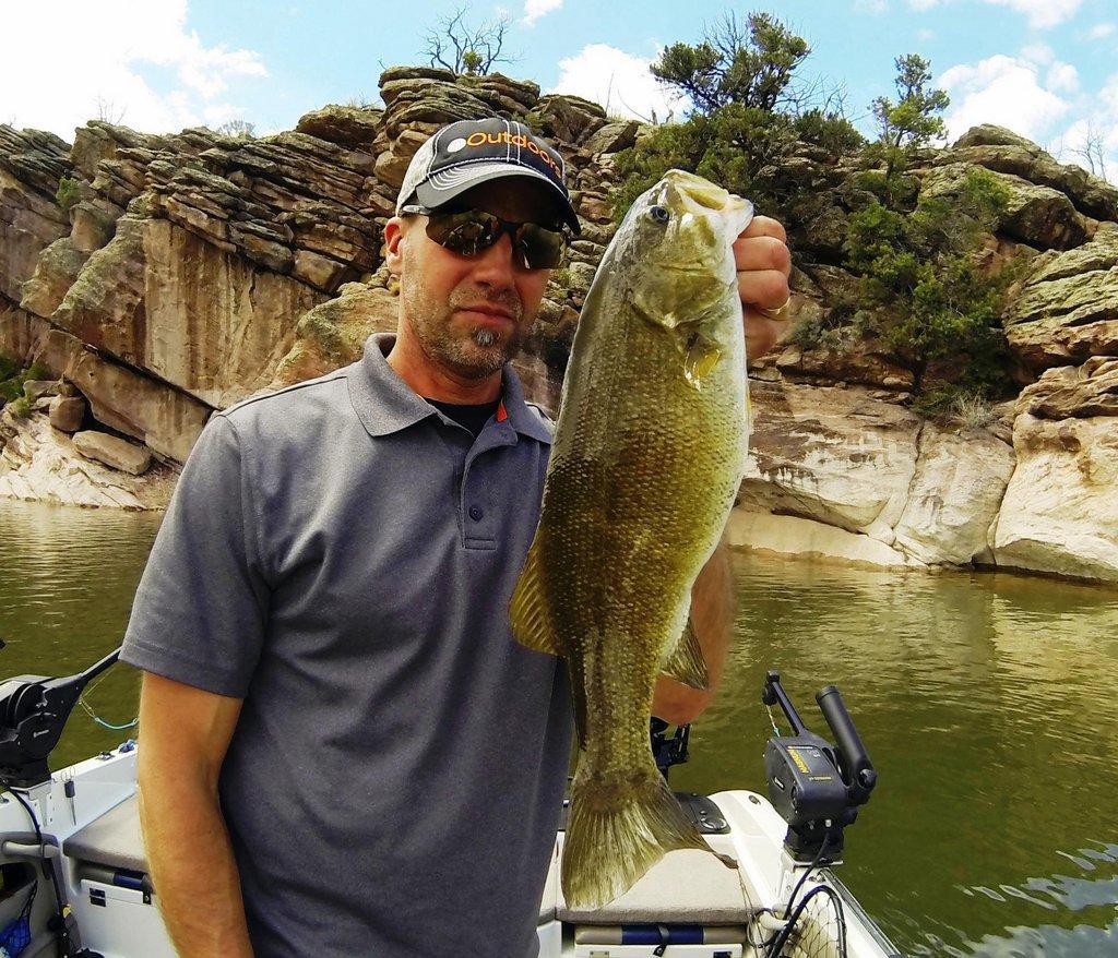 ryan_mosley_5-10-2017_Ryan_Mosley_with_smallmouth_bass_at_Flaming_Gorge_Reservoir.jpg