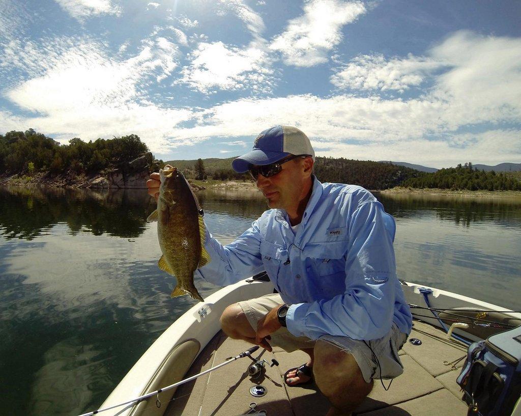 ryan_mosley_5-10-2017_Ryan_Mosley_with_smallmouth_bass_caught_at_Flaming_Gorge_Reservoir-scaled.jpg