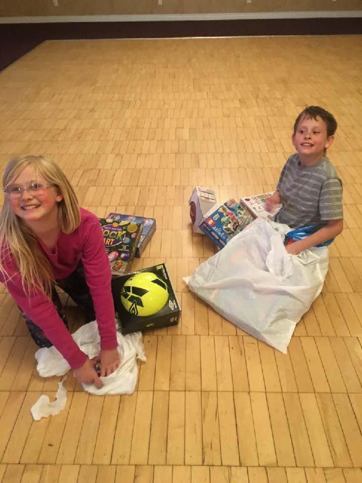 media-release-2-kids-with-gift-bags-2-11-22.jpg