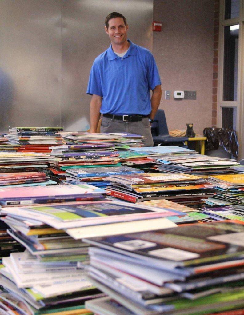 Chris-Winfree-in-front-of-leveled-books.jpg