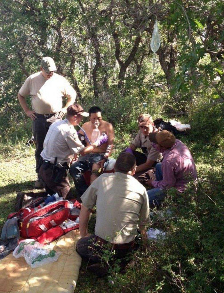 DWR-officers-assist-the-victim-of-an-attack-by-a-bull-elk-on-the-LaSal-Mtns.-Photo-by-Chris-Wood.jpg