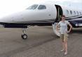 Jennifer-Jensen-in-front-of-a-jet-at-Buck-Davis-Field..jpg