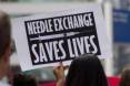 Needle-Exchange-Saves-Lives-protes-CROPPEDt-300x199.jpg
