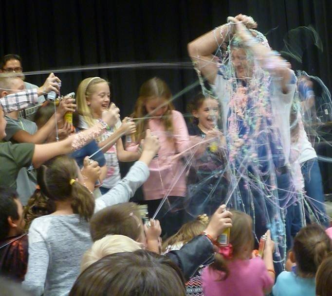 Students-inundate-Principal-John-Thomas-during-the-celebration-at-Creekview-Elementary..jpg