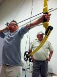 Walt-Maldonado-coaches-Price-youth-at-DWR-archery-clinic-in-2013-by-B.-Stettler1.jpg