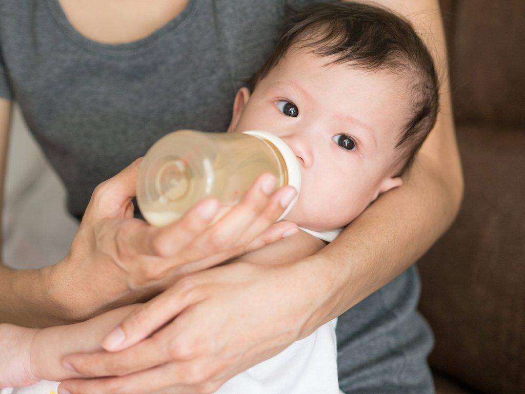 infant-with-bottle-scaled.jpg